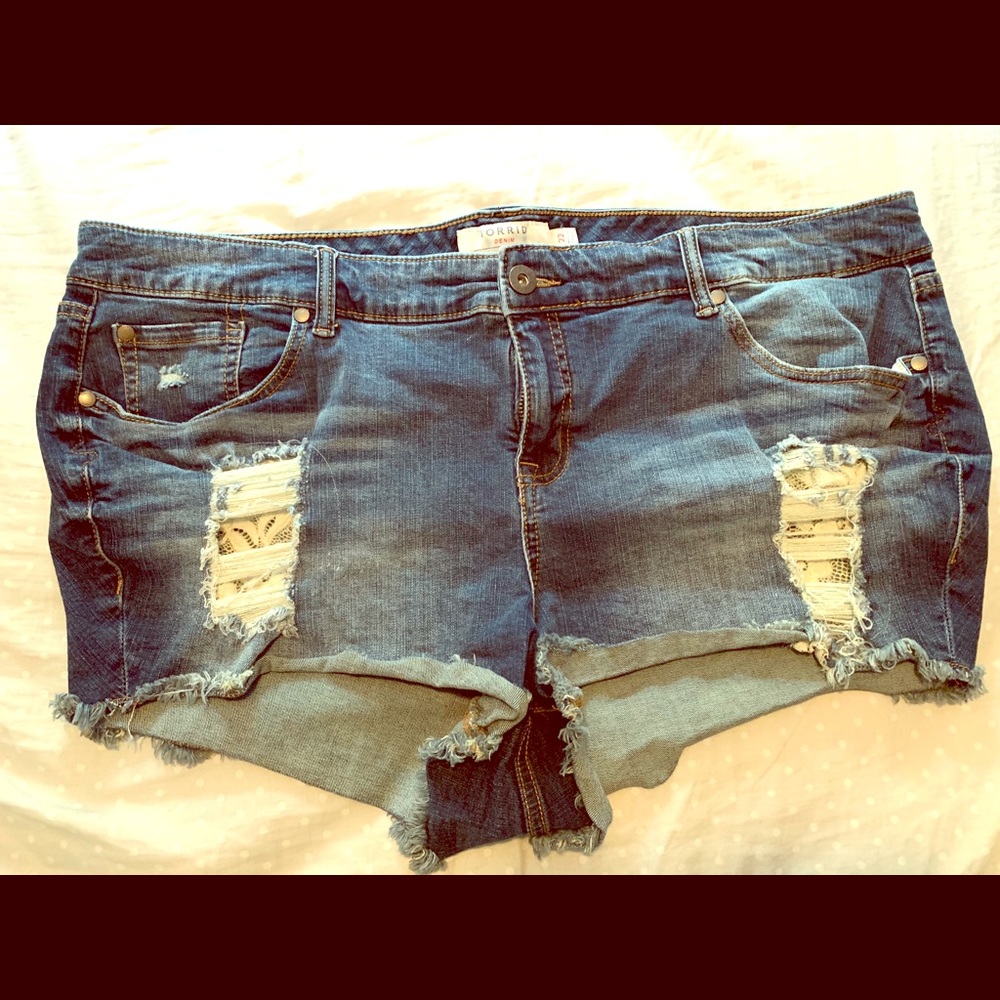 Torrid lace distressed shorts.
